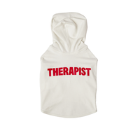 Back view of cream dog hoodie showing large red THERAPIST text on the back on a white background