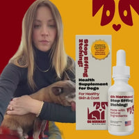 Actress Kaley Cuoco holding a small dog next to a bottle and box of Stop Effing Itching! pet supplement on red and yellow background